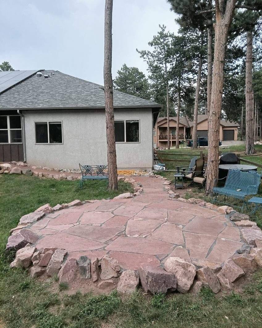Flagstone patio surrounded by mountain pines