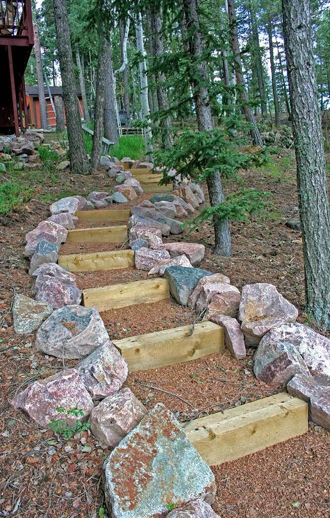 Timber and boulder switchback steps winding through an aspen forest